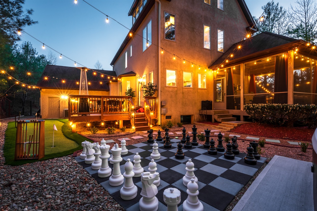 Outdoor giant chess + designer backyard setup - one of many spaces built for gathering and having fun together