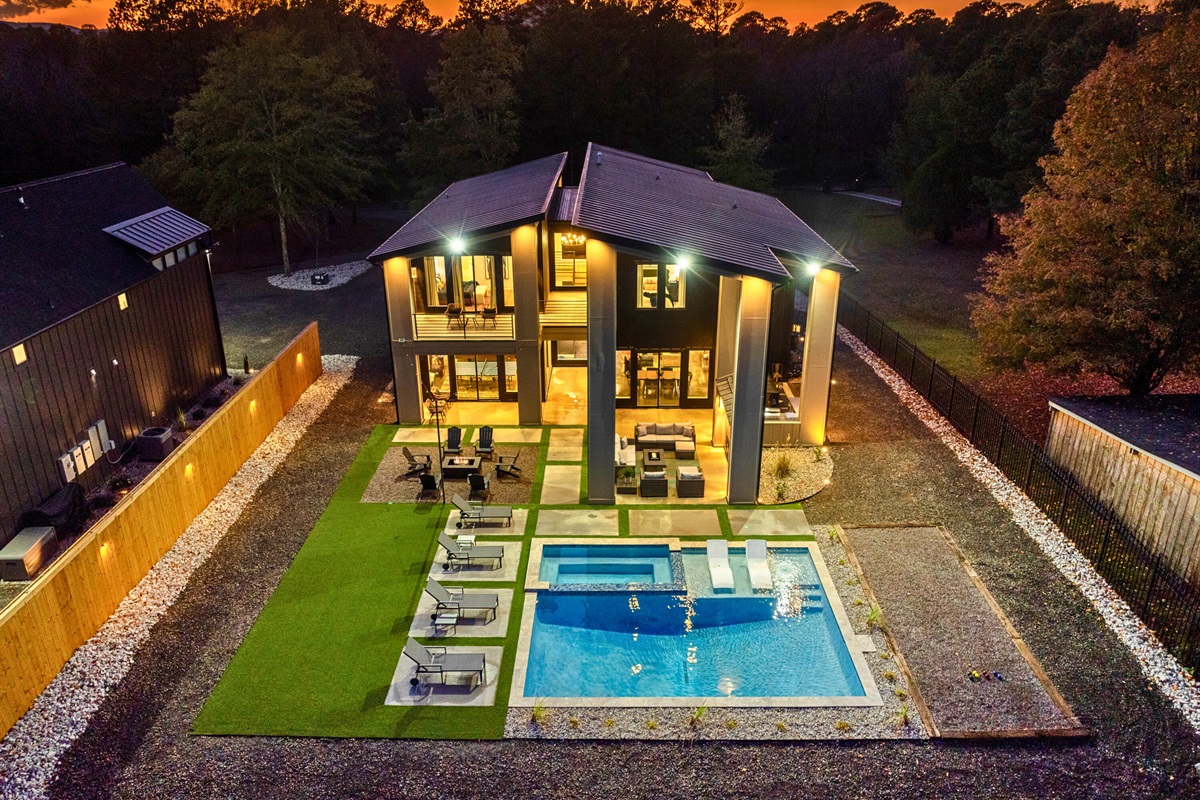 A beautiful night view of the pool area, your private oasis that comes alive under the stars &ndash; perfect for peaceful moments.
