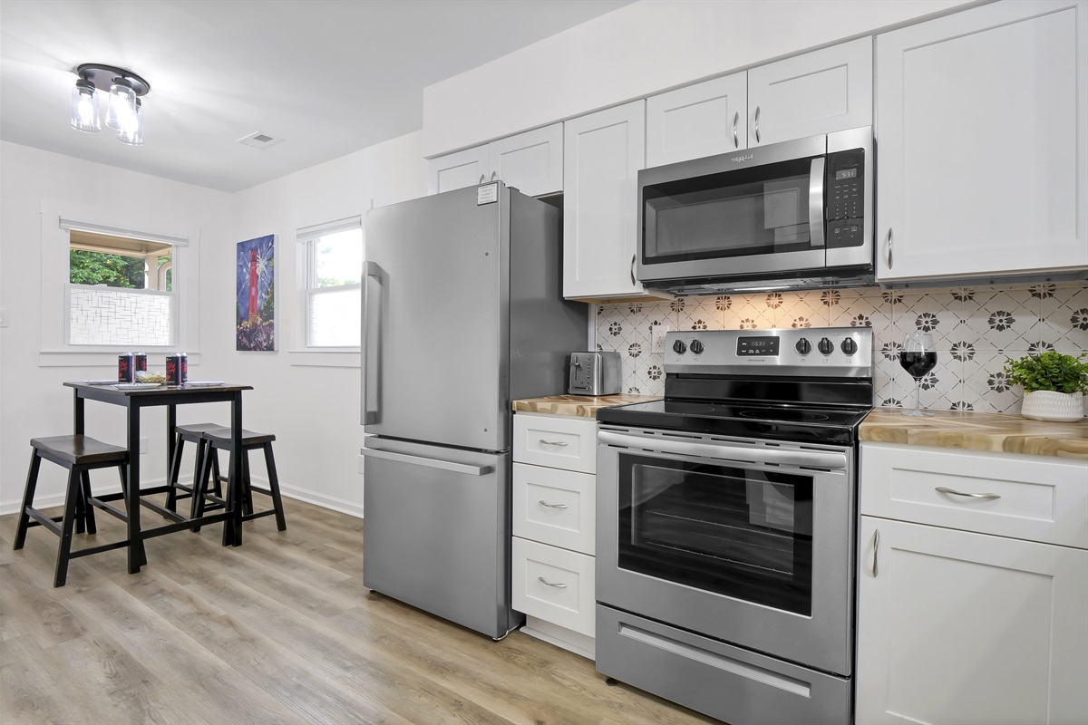Modern kitchen featuring high-end stainless steel appliances.