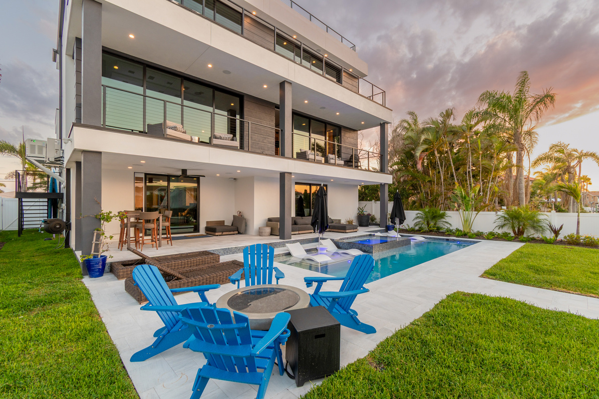 Enjoy indoor outdoor living with pocket doors on each floor while enjoying the pool with friends and family