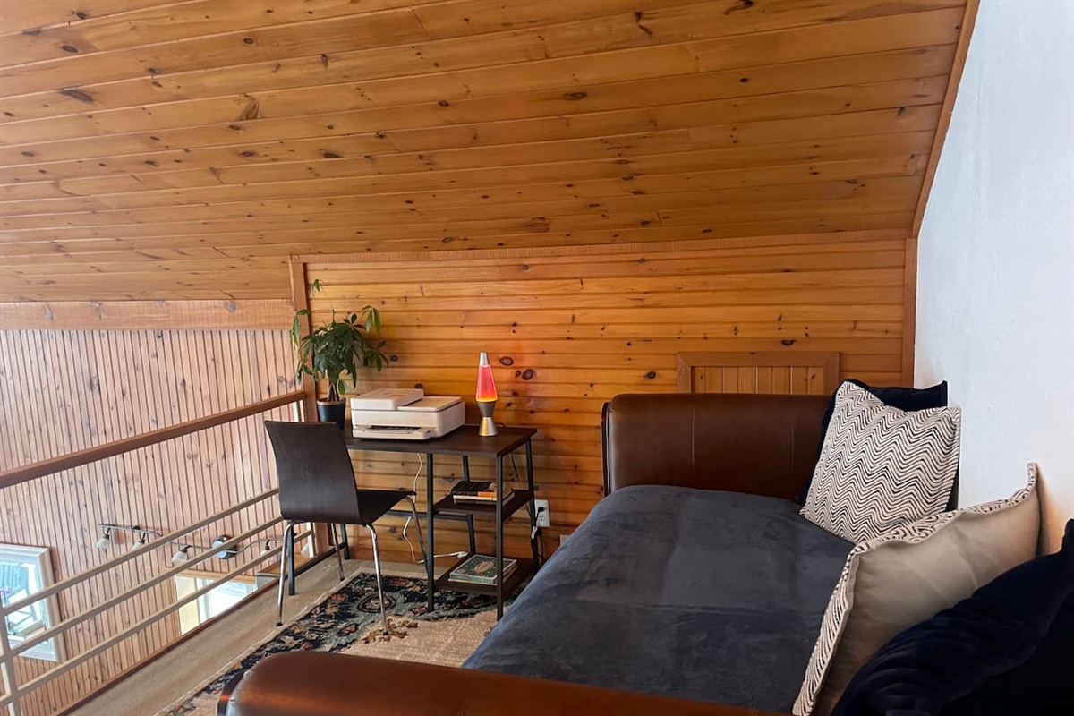 Loft seating area overlooking the main living space.