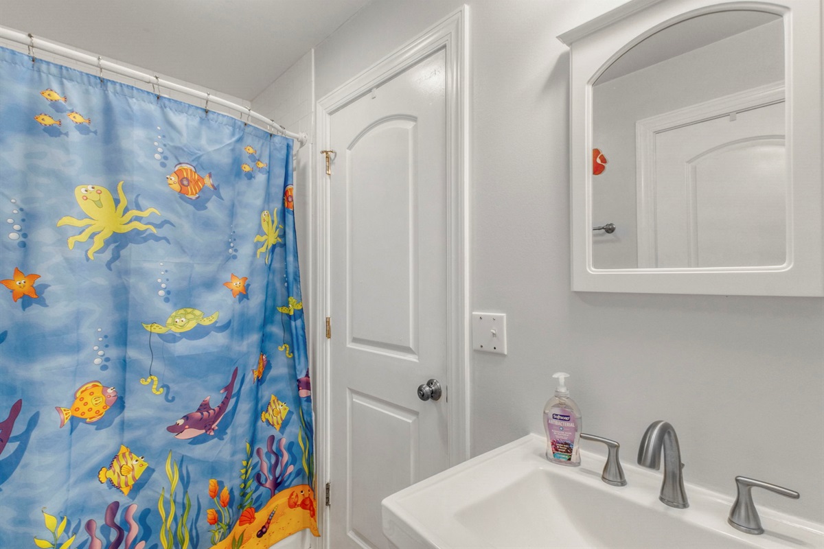 The Jack and Jill bathroom is shared by the twin room and the bunk bed room. It also offers a tub/shower combo.