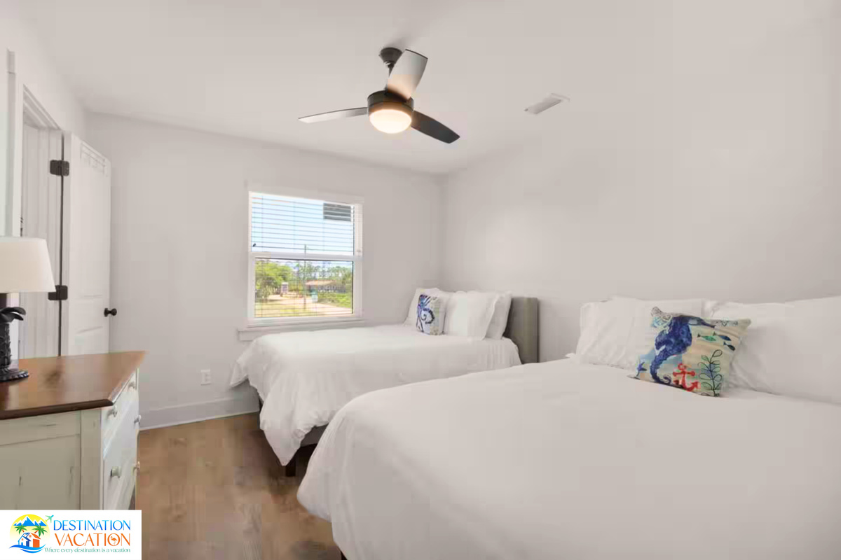 Bright bedroom offers comfort, simplicity, and natural light.