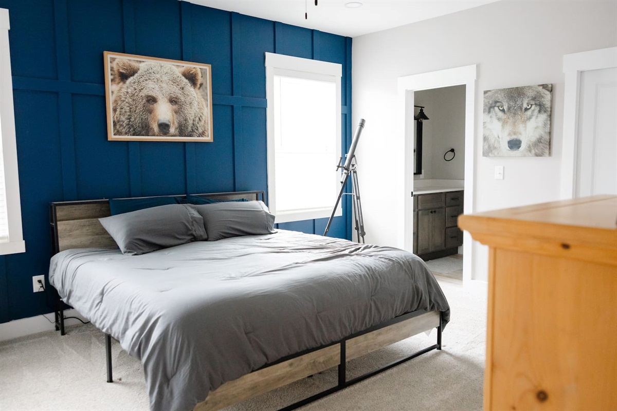 Large bedroom with private sink and shared access to private shower/toilet rooms with bedroom #2. Quaint under stair nook on opposite wall.