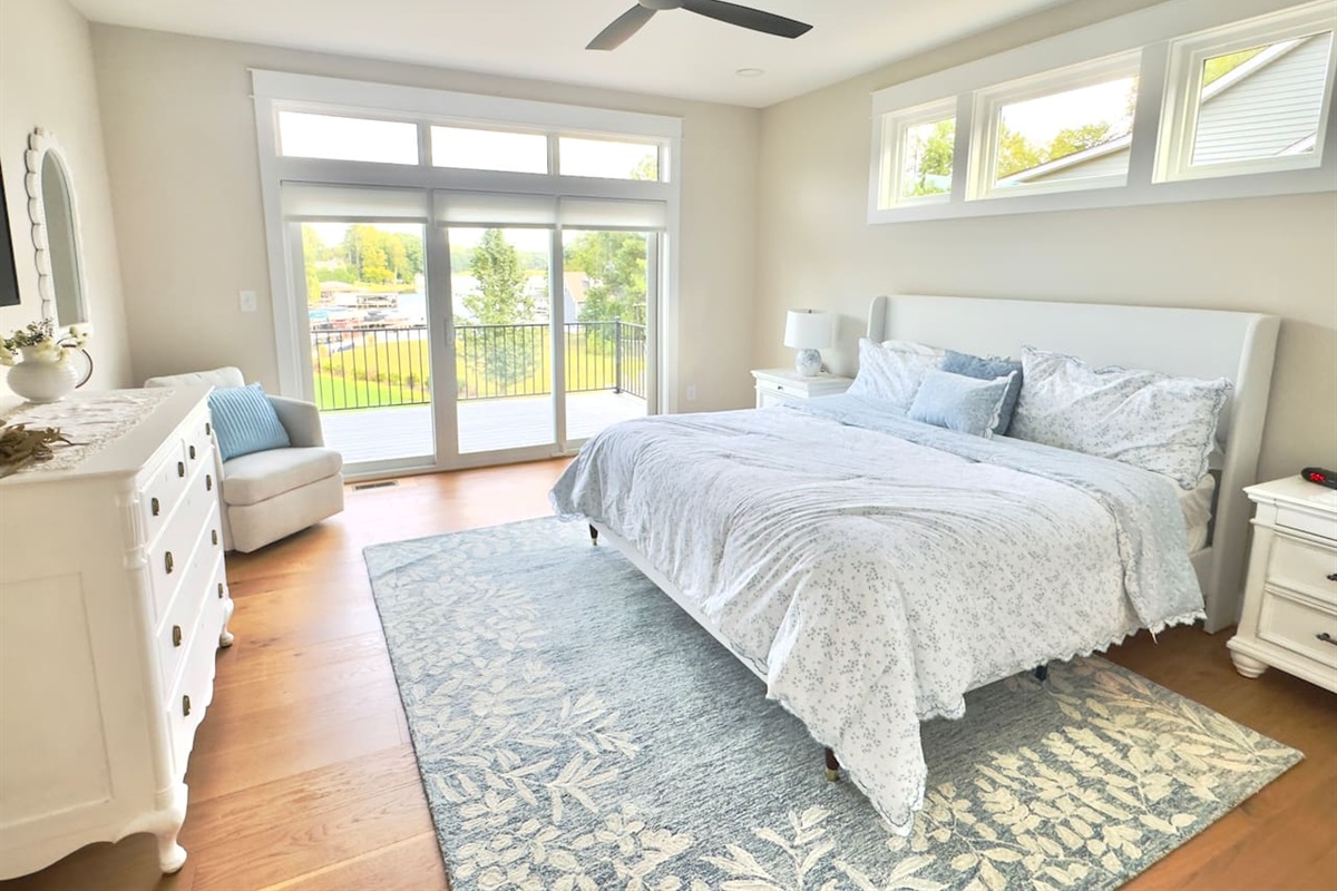 The main king suite is an indulgent retreat wrapped in layers of crisp whites and blues that mirror the tranquility of the lake,elevated with refined details, antique touches & plush bedding & feels like a private retreat where elegance meet serenity
