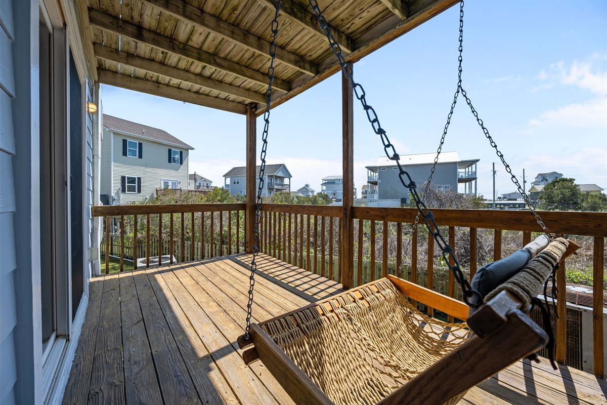 Covered deck with hammock seating and open views
