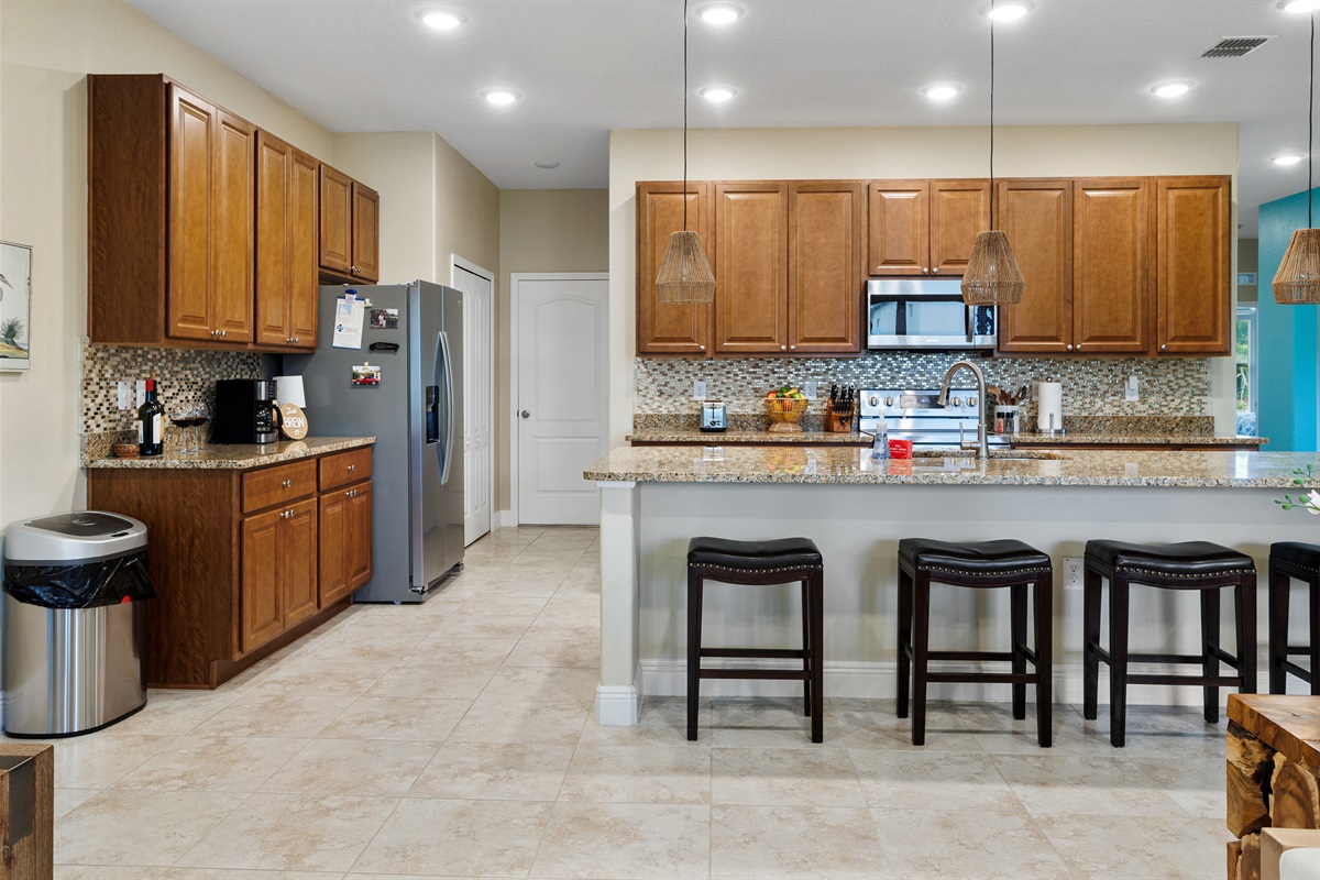 Granite kitchen with cherry cabinets.