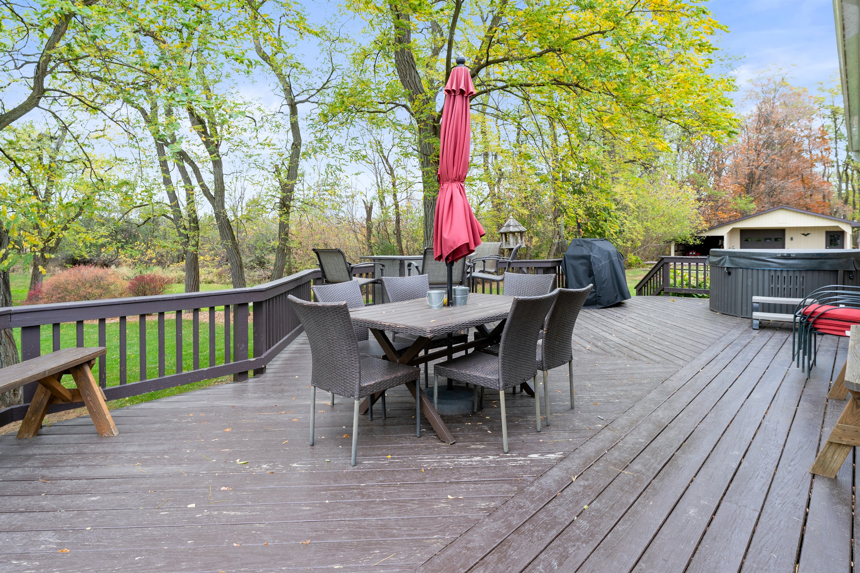 Spacious outdoor dining area with grill and seating — perfect for group meals and lakeside vibes.