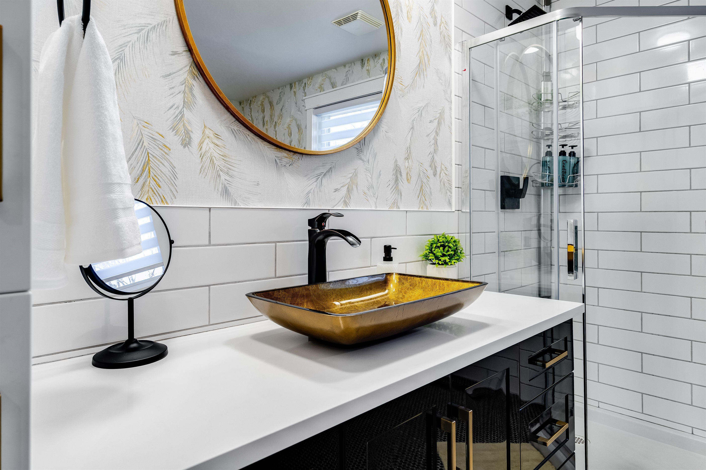 A Full bathroom with a serene spa experience in sculpted stone
