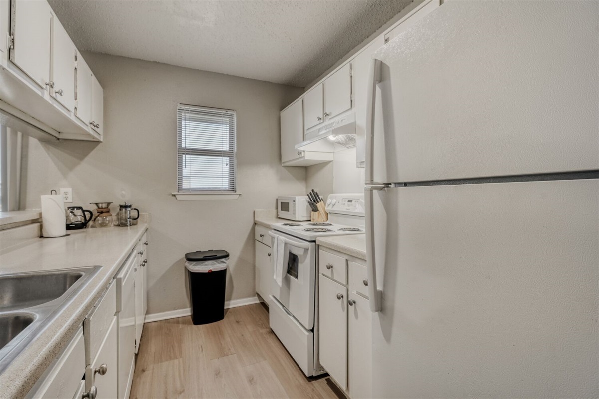 Bright, fully equipped kitchen with modern appliances.
