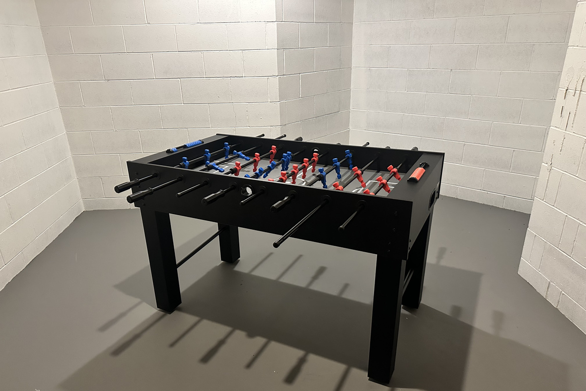 Foosball adds another option for some friendly competition in the downstairs game area.