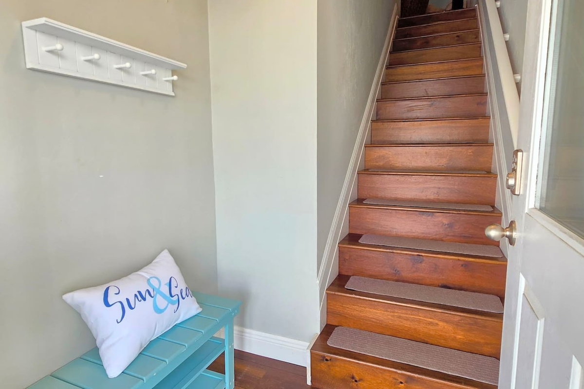 The foyer greets you with bench seating and hooks &mdash; a spot to drop the beach bag, kick off the sandals, and make the transition from car to vacation in one easy step.