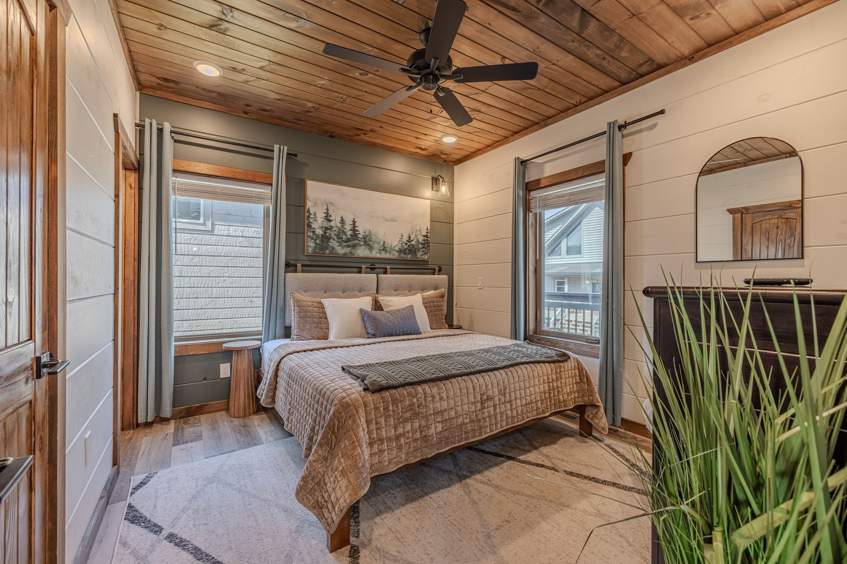 Main level king bedroom with bedside lighting and a comfortable setup.