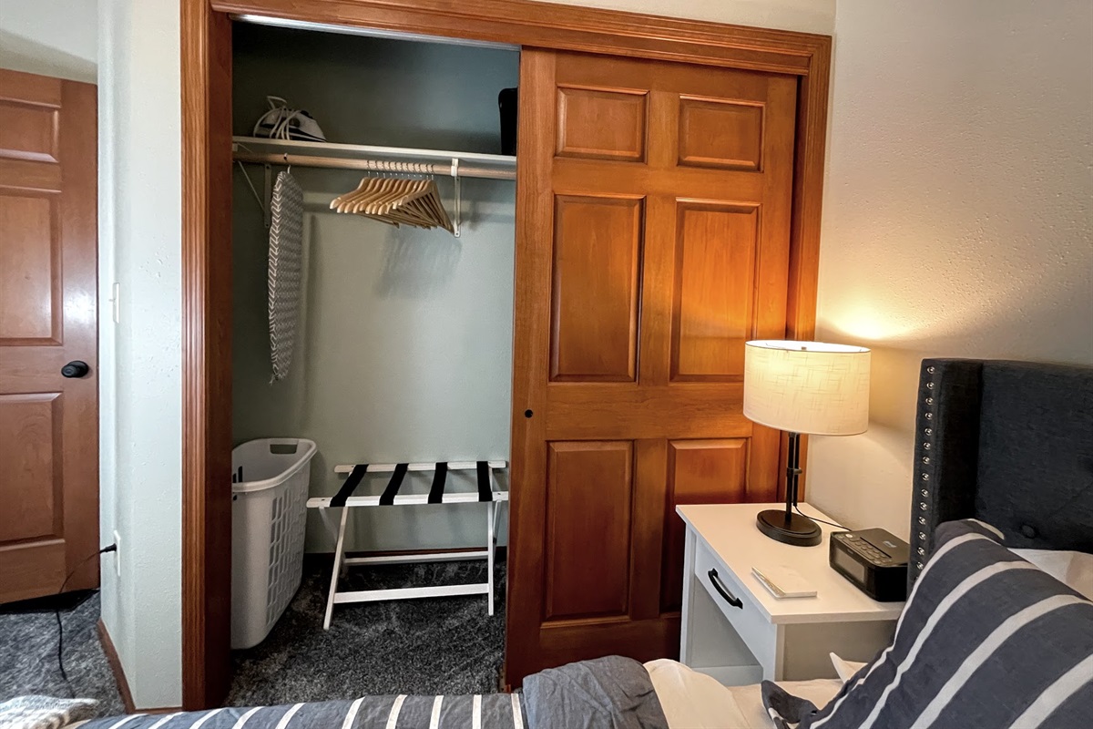 Master closet main cottage with bedding for queen living room couch sofa sleeper, Iron board, extra chairs (2) for butterfly leaf, hangers, laundry basket, luggage rack