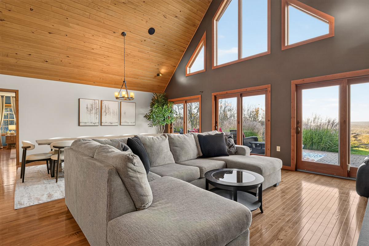 Living room with sectional sofa and large windows