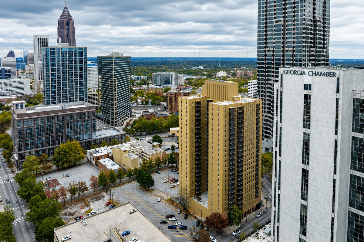 A stunning panoramic view of downtown Atlanta, showcasing a striking skyline of modern skyscrapers, residential towers, and bustling city streets.