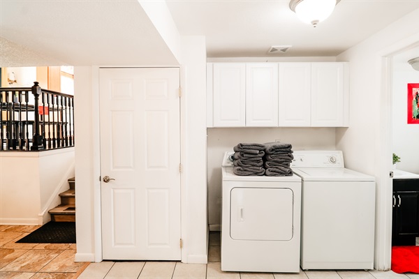 Nestled against a backdrop of a pristine white door and cabinets, the washer and dryer duo promises efficiency and style in one.