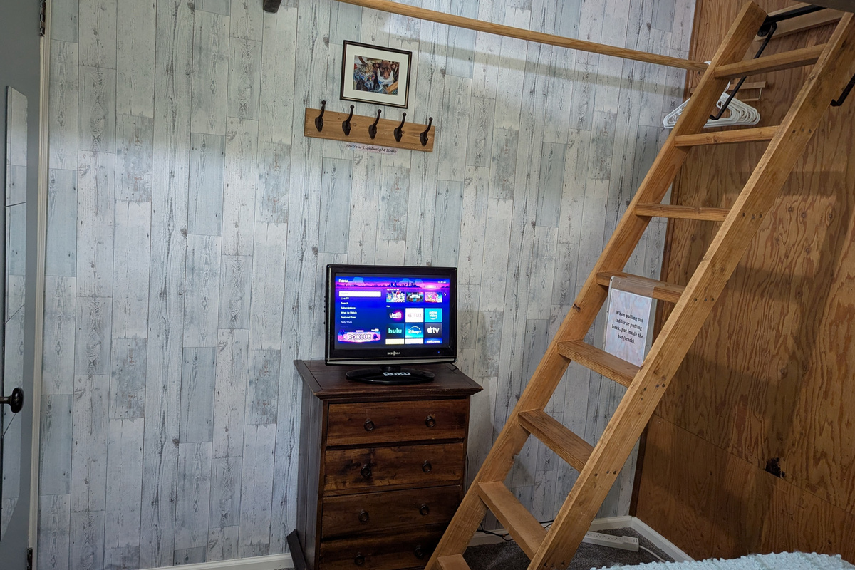 Two tv's. Living room & primary bedroom. Both use "guest ROKU." Bring your streaming passwords or watch free tv offered. This is a small tv in the primary bedroom.