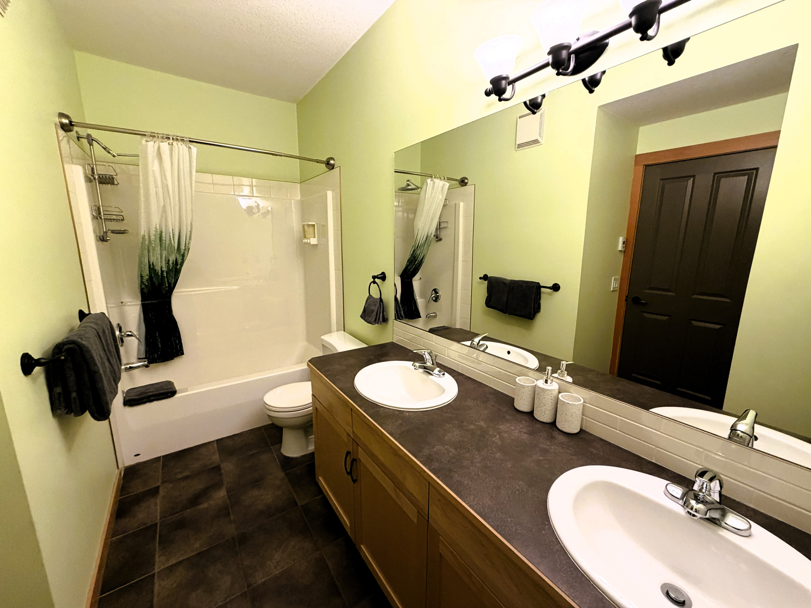 Master ensuite bathroom, with his and hers sink, shower, and tub.   Heated floor! 