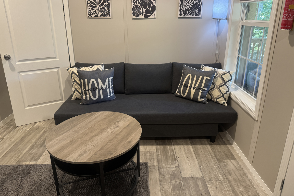 Living room with sleeper sofa, perfect for relaxing or extra guests