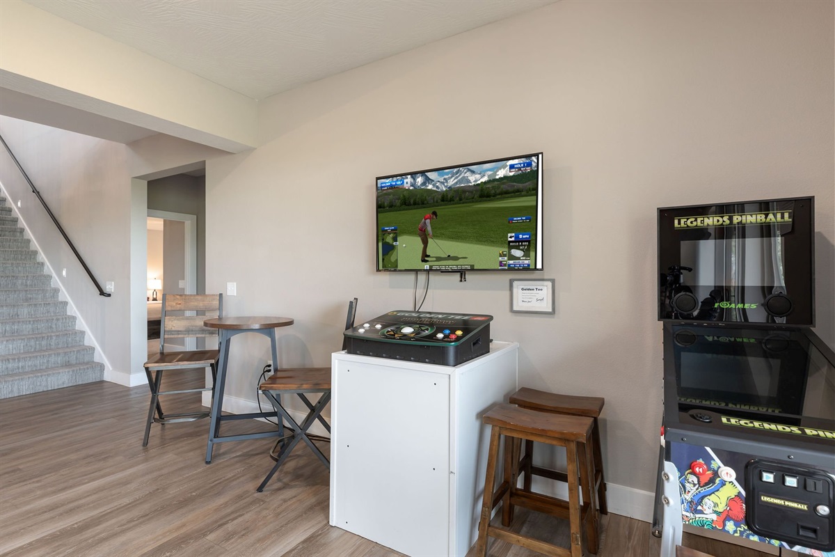 Challenge the family to a golden tee game or some virtual pinball!