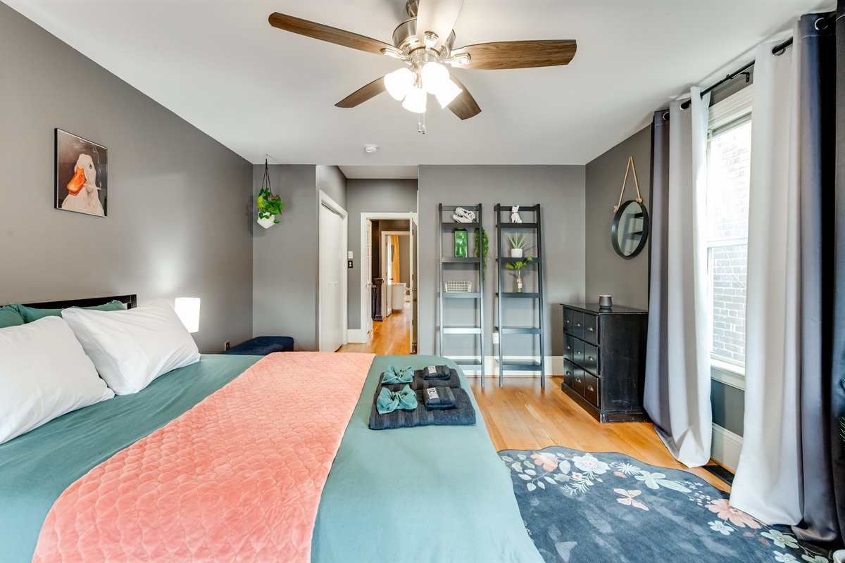 Queen Bedroom 3: Bright space with modern decor, plush bedding, and vibrant accents awaits you!