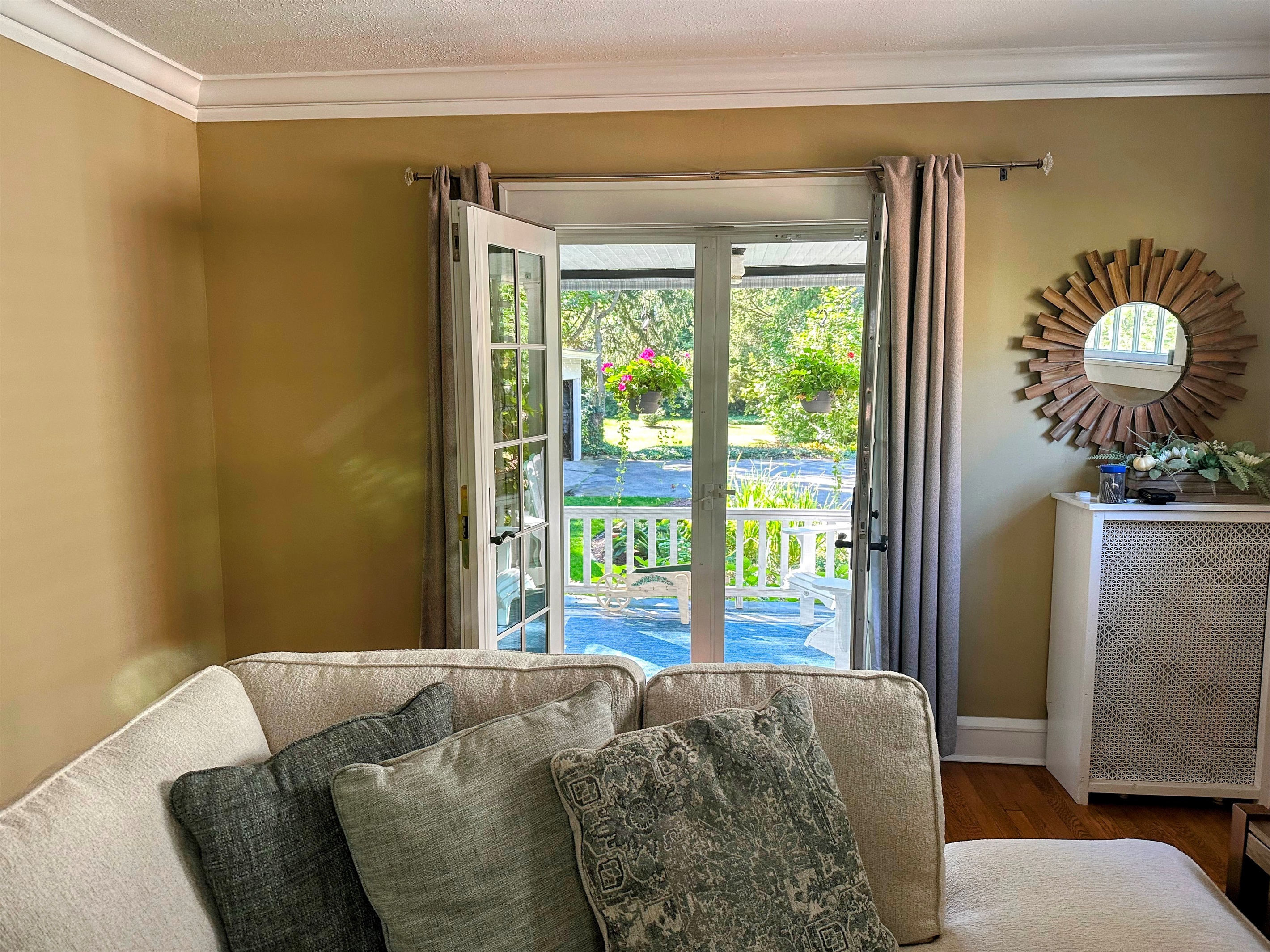 French Doors Lead from the Living Room to the Back Porch Area