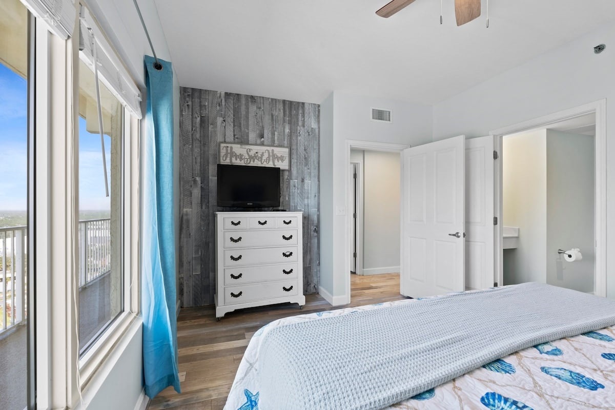 Main bedroom 2 with ceiling fan and ensuite access