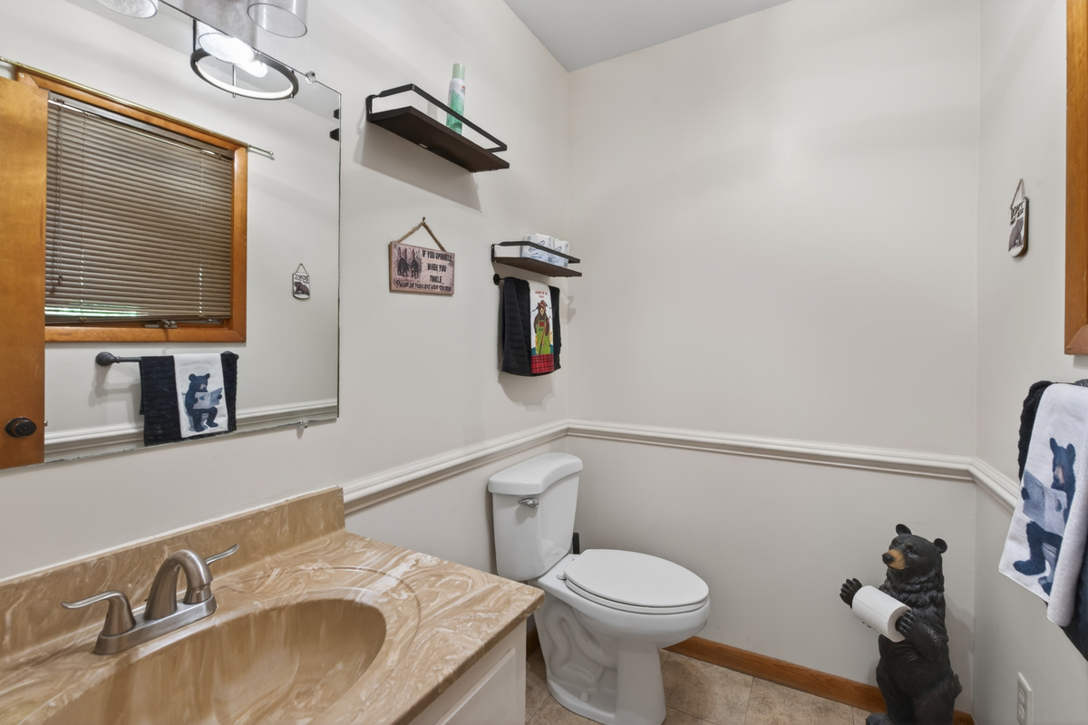 Bathroom Retreat: Relax in style with charming decor and convenient amenities for your stay!