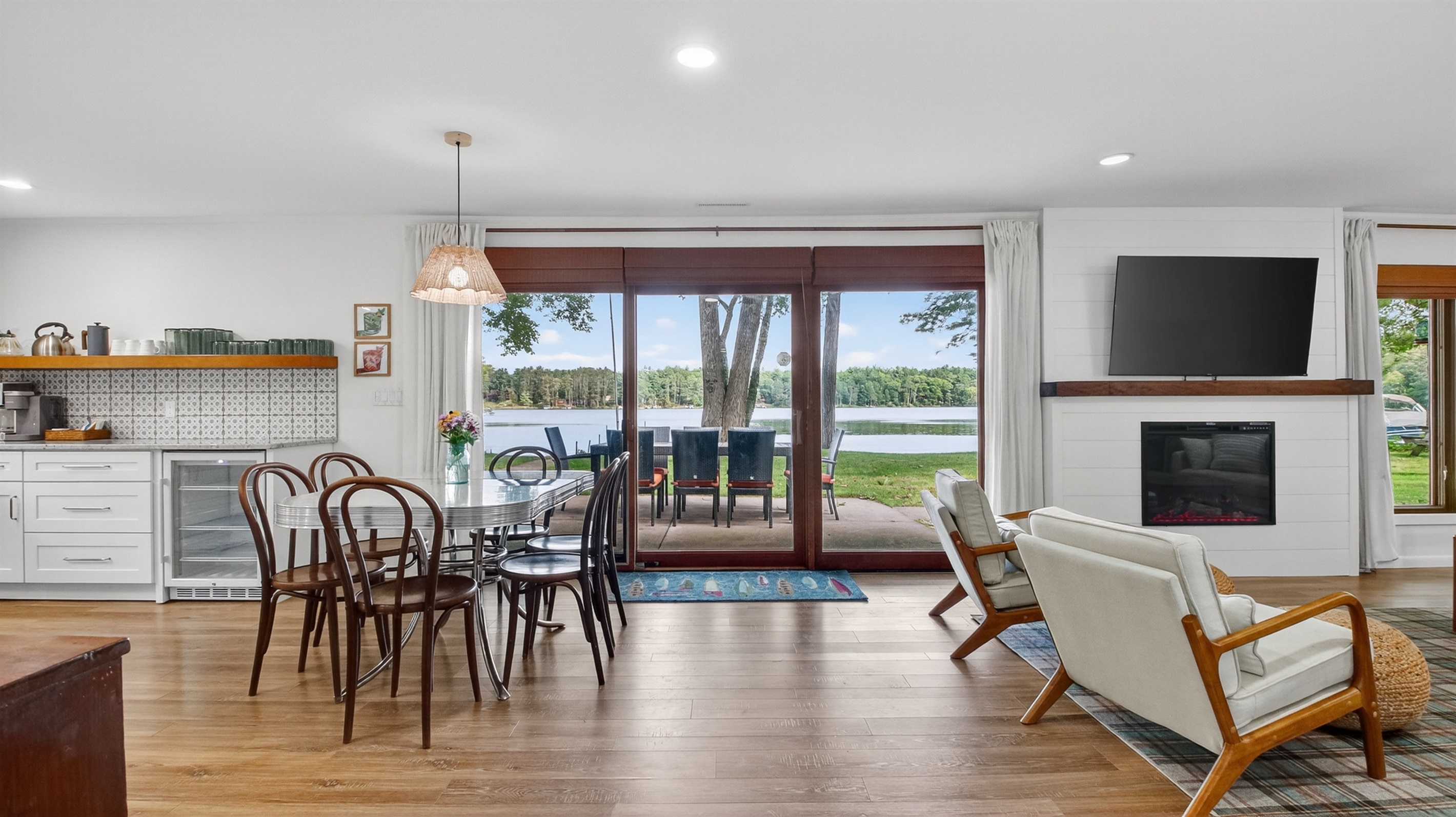 Step right out to the lake and outdoor dining for 8 through the sliding glass doors.