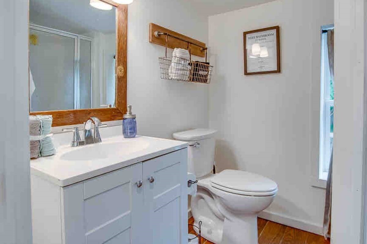 Bathroom off the master bedroom. Downstairs full bathroom with wall in shower.