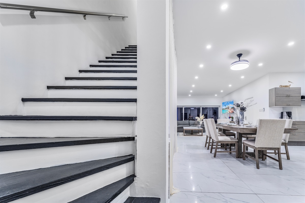 Wide shot of stairs and dining area