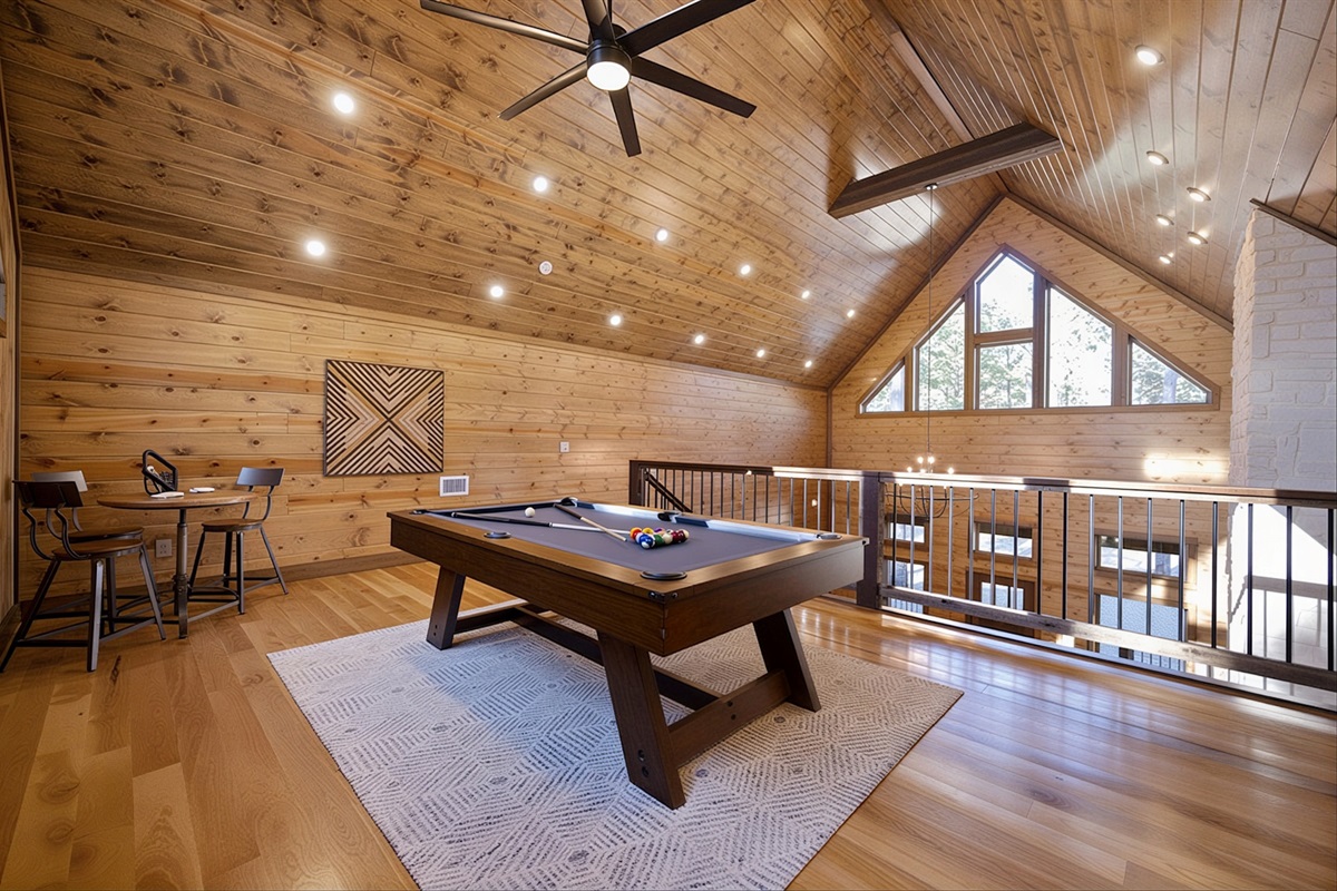 Upstairs loft dedicated to fun with a pool table and 2-person arcade- games and relaxation.