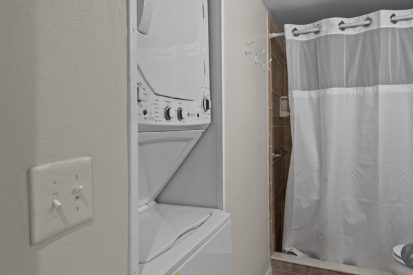 Washer and Dryer located in bathroom.