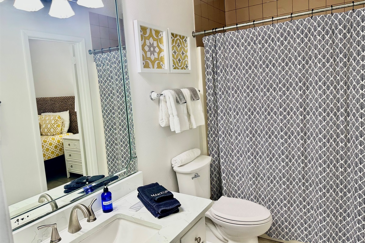 You can enter the bathroom from the bedroom or the hallway...