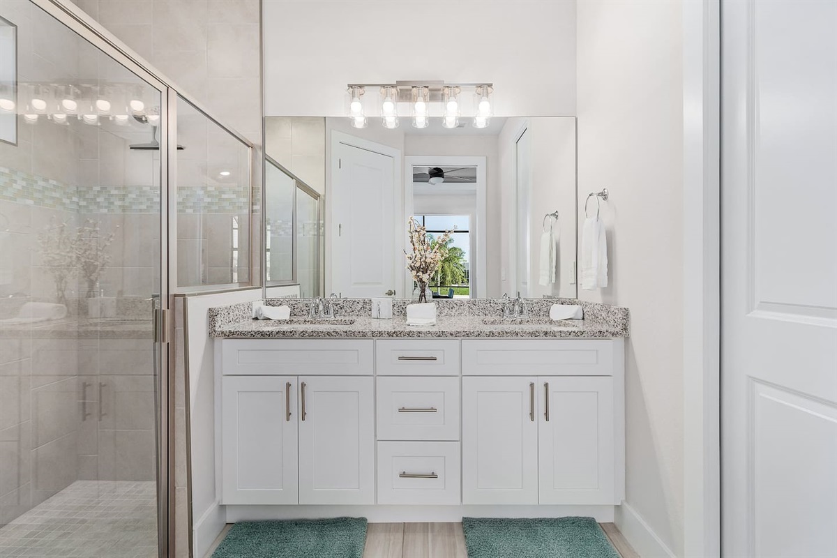 2nd Primary ensuite bathroom with dual sinks and shower.
