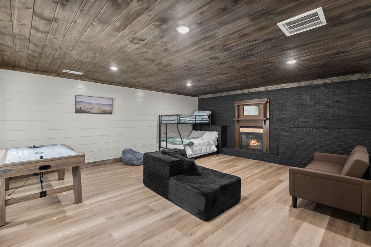 Game Room with twin over full bunk bed with trundle and couch that makes into a bed