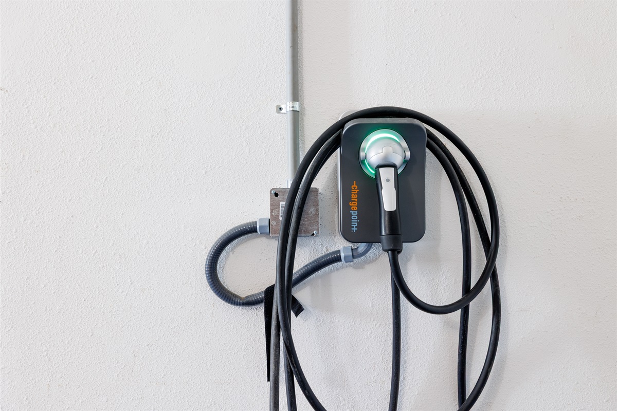 EV charger with free charging for registered guests