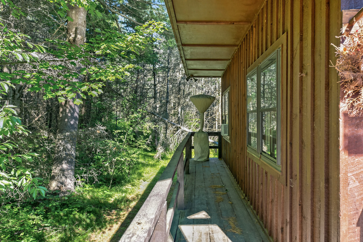 Side porch with wooden exterior walls