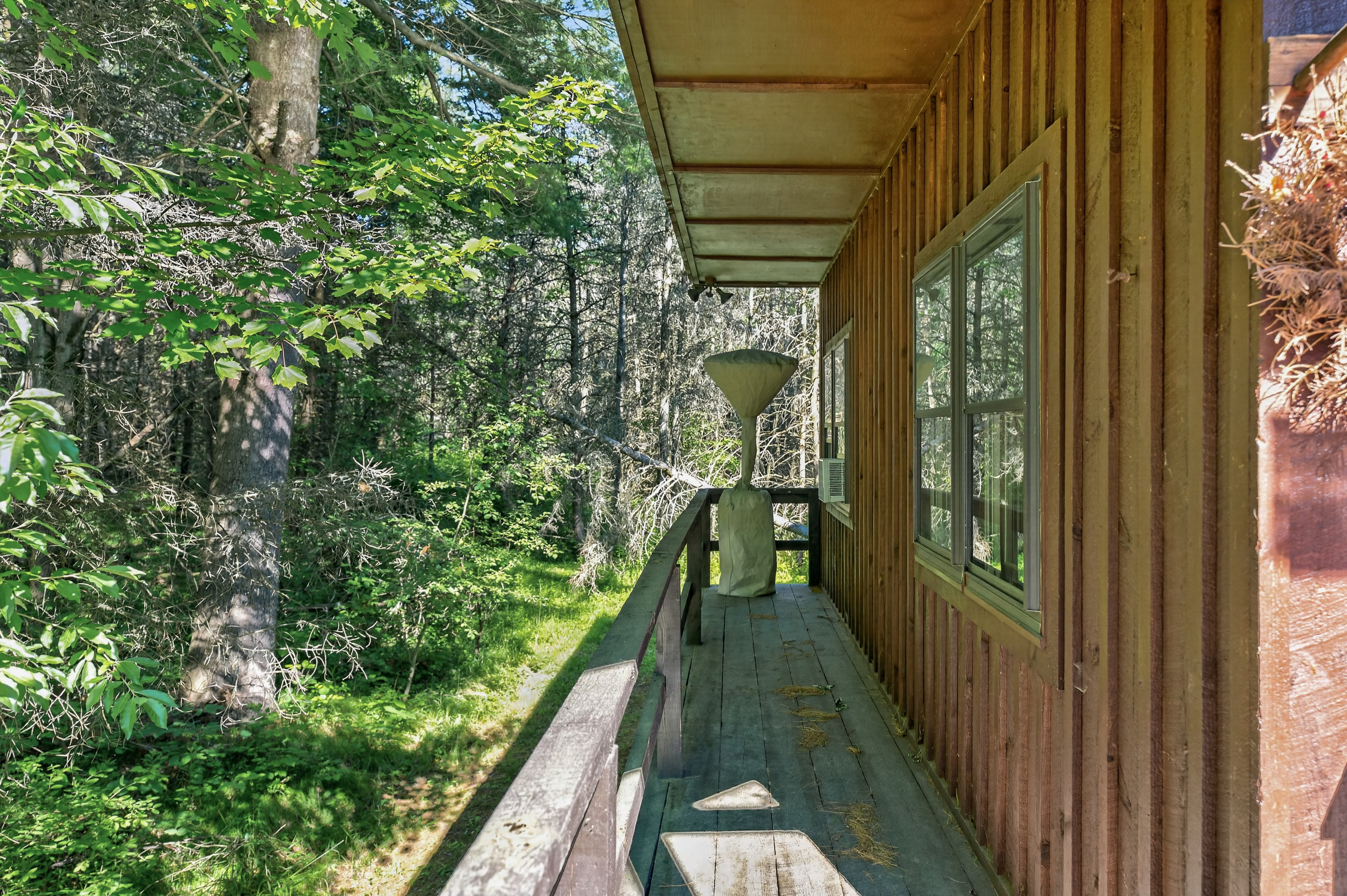 Side porch with wooden exterior walls