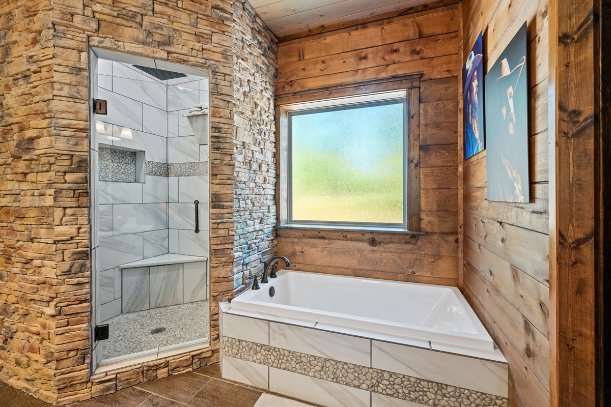 Natural light fills this bathroom, highlighting the beautiful stonework and clean, modern design.