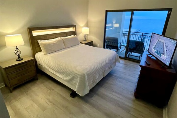 East Master bedroom king bed, balcony. built in USB in night stands