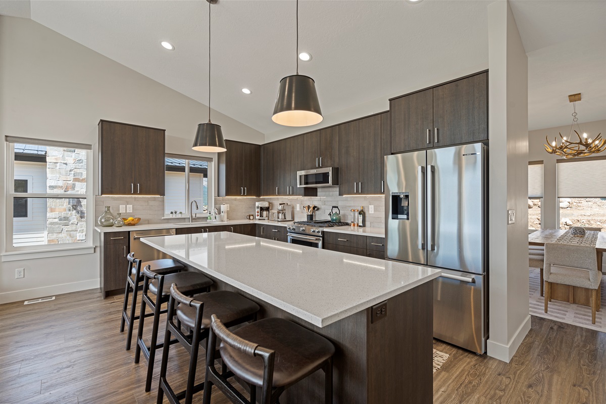 Open-concept kitchen flowing into the dining area, designed for gathering and entertaining.