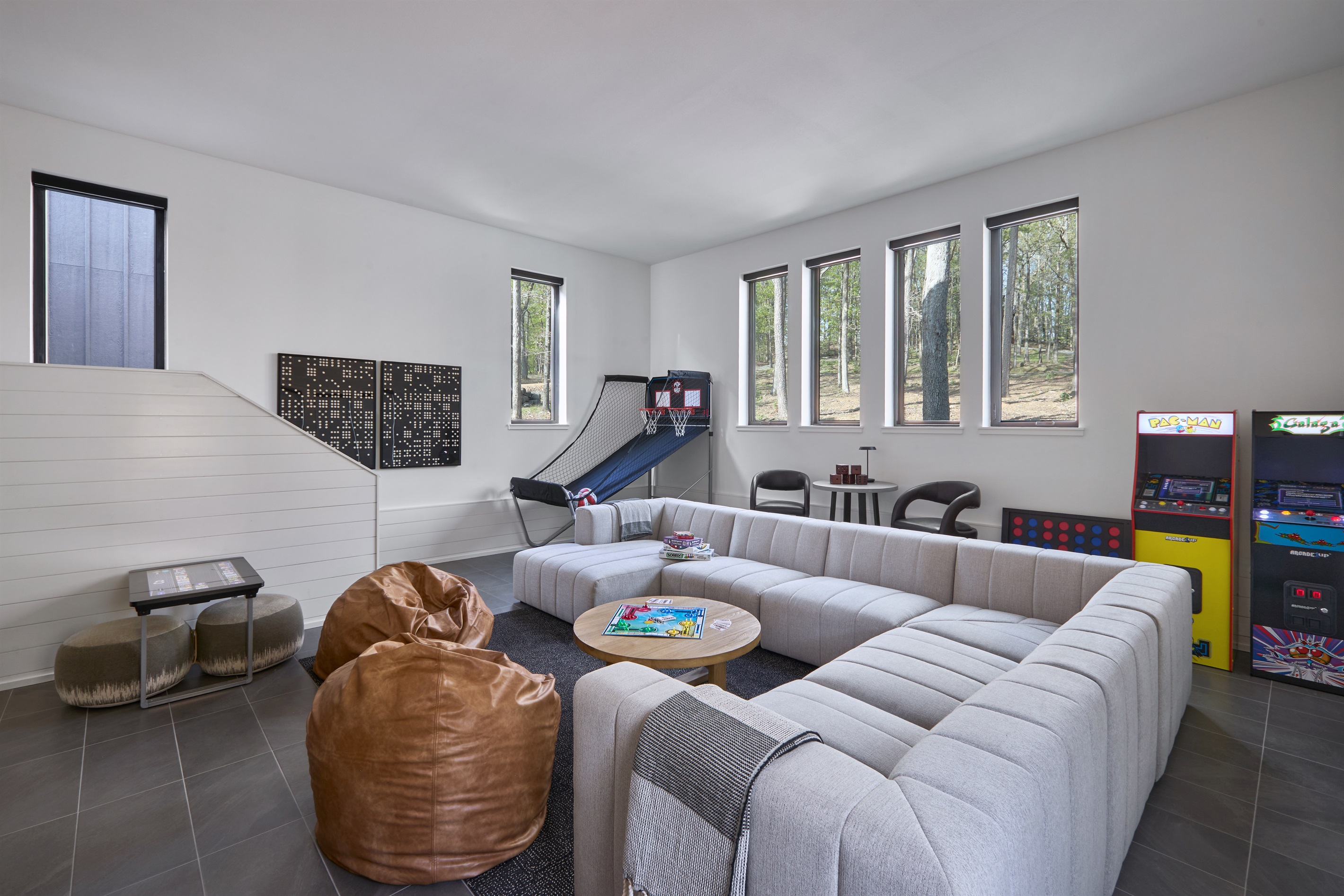 Relax and reconnect in the spacious game room, complete with plush sectional seating and fun for all ages.