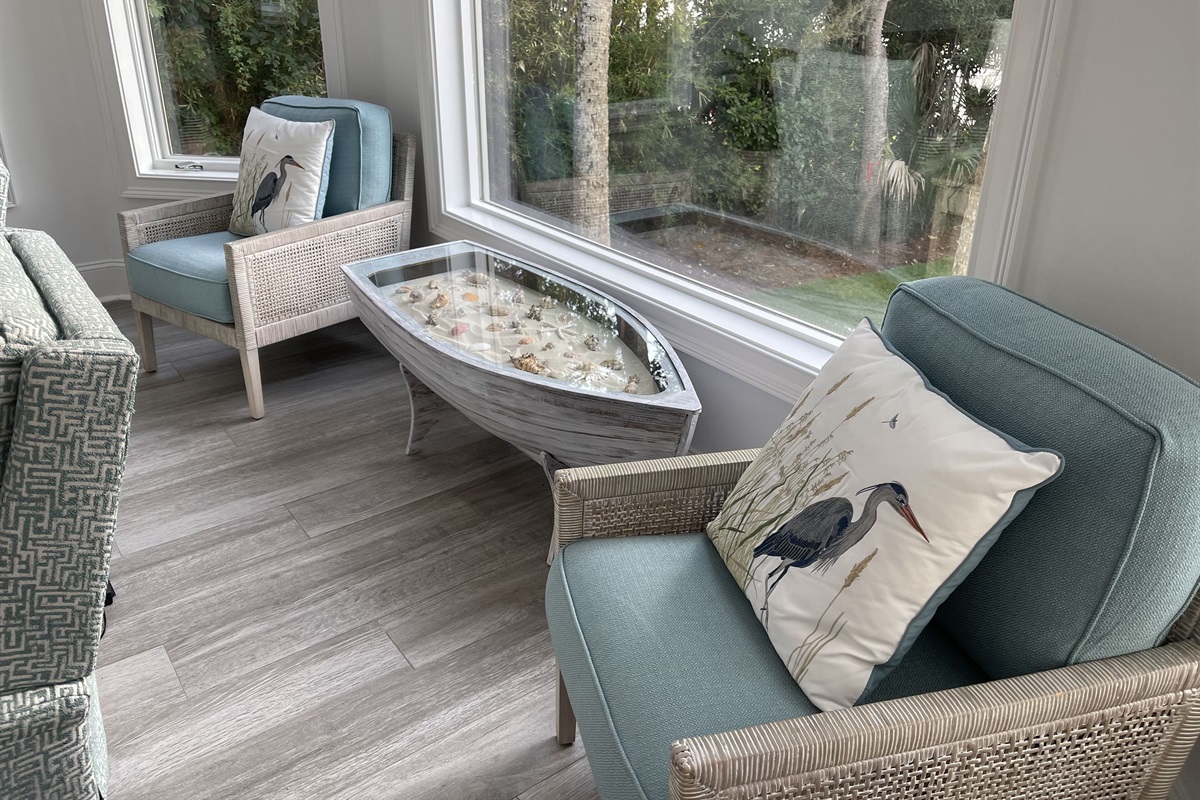 Row, row, row your boat to this special sitting area with a custom coffee table.