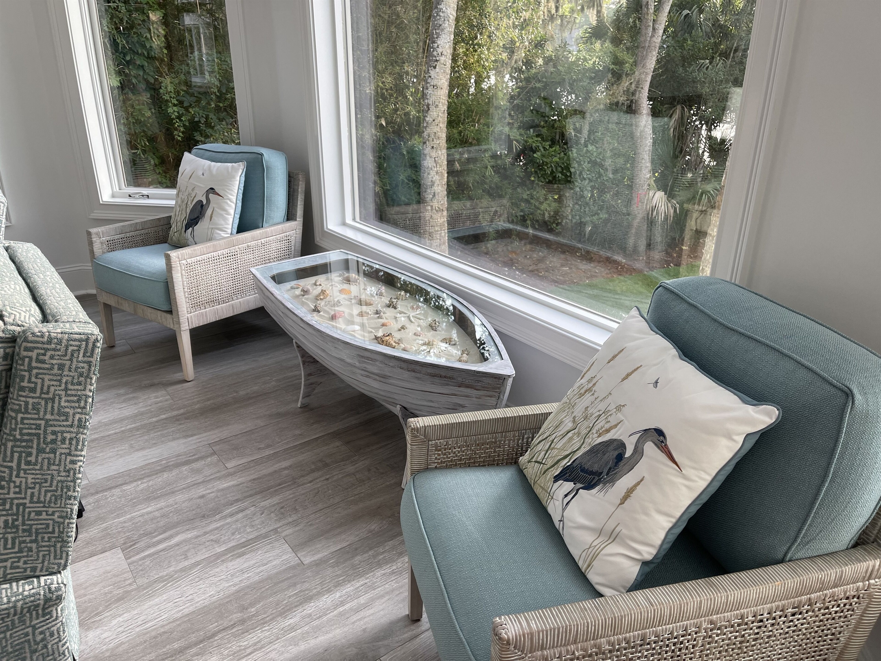 Row, row, row your boat to this special sitting area with a custom coffee table.