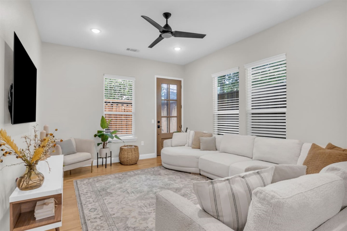 Living room with sectional seating and neutral décor.