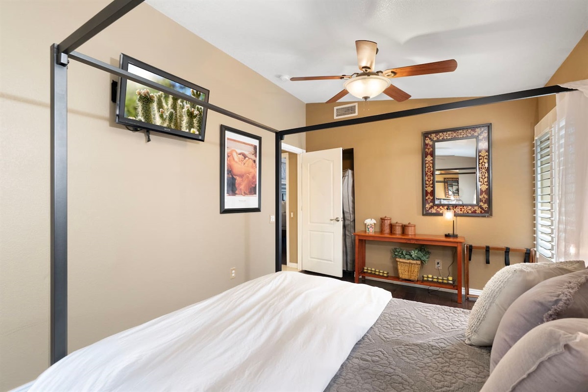 Catch your favorite shows from bed on the wall-mounted TV, or wind down at the decorative console — bedroom 2 has everything you need for a comfortable, self-contained stay.
