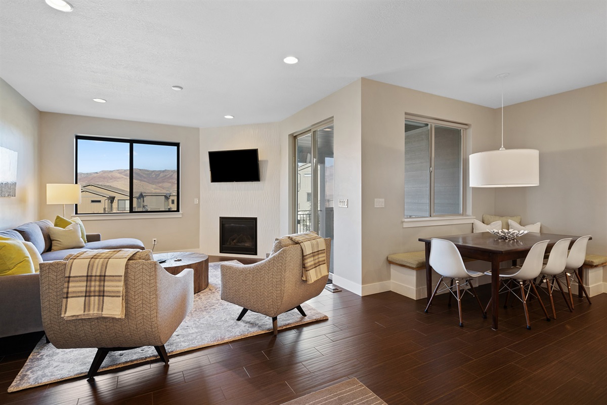 Bright, open living space with cozy seating and modern finishes. Seating for 9 at the dining table.