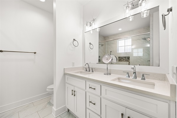 The double vanity offers added convenience, ample counter space, and a comfortable setup for multiple guests.